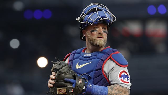 Chicago Cubs catcher Tucker Barnhart looks in to his dugout between batters.